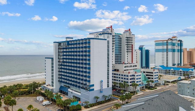 exterior space featuring a view of the beach and a water view