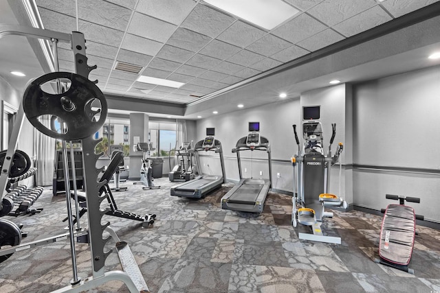 workout area featuring a drop ceiling