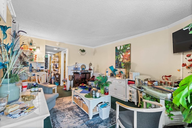 living room featuring a textured ceiling and ornamental molding