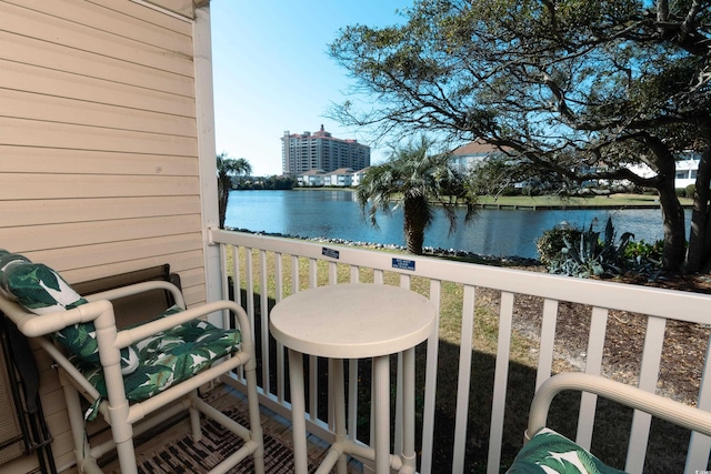 balcony featuring a water view