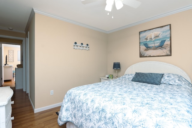 bedroom with baseboards, ornamental molding, a ceiling fan, and wood finished floors