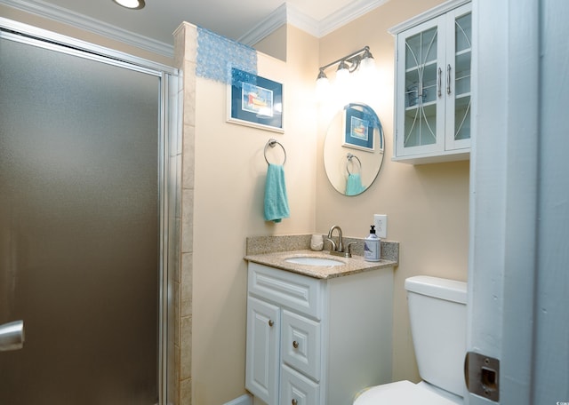 full bath featuring vanity, toilet, a stall shower, and ornamental molding