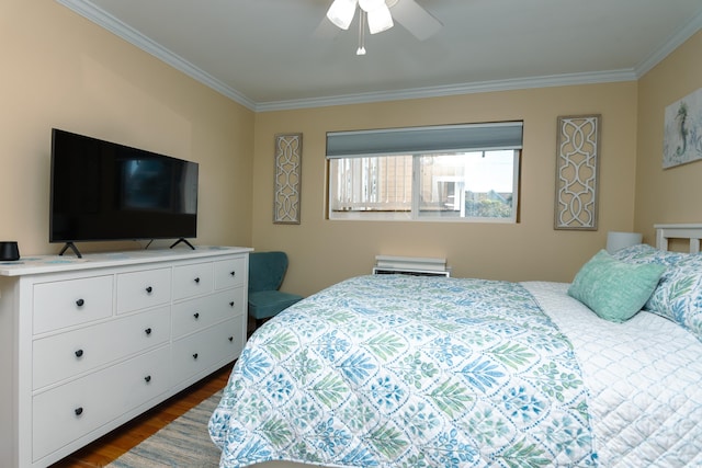 bedroom with ornamental molding, dark wood-type flooring, and ceiling fan