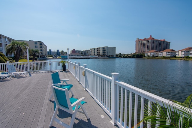 dock area featuring a deck with water view