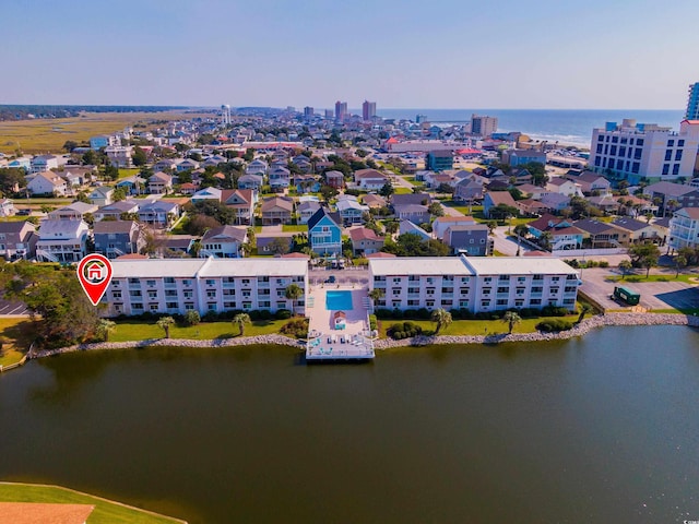 birds eye view of property featuring a water view