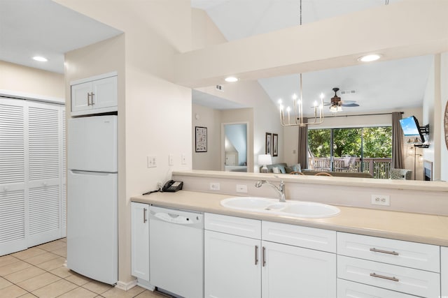 bathroom featuring tile patterned floors, vaulted ceiling, and vanity