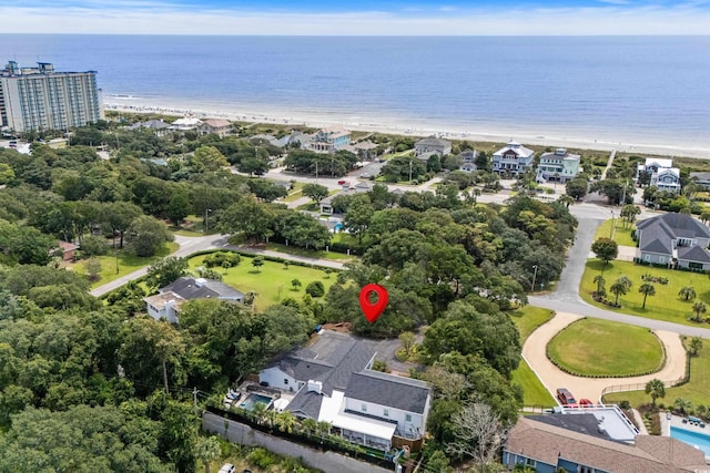 birds eye view of property featuring a view of the beach and a water view