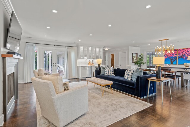 dining room featuring ornamental molding, dark parquet floors, a chandelier, beverage cooler, and built in features