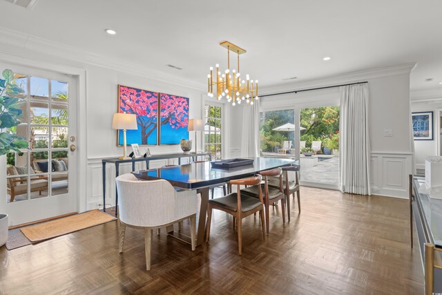 bedroom featuring access to exterior, multiple windows, ceiling fan, and crown molding