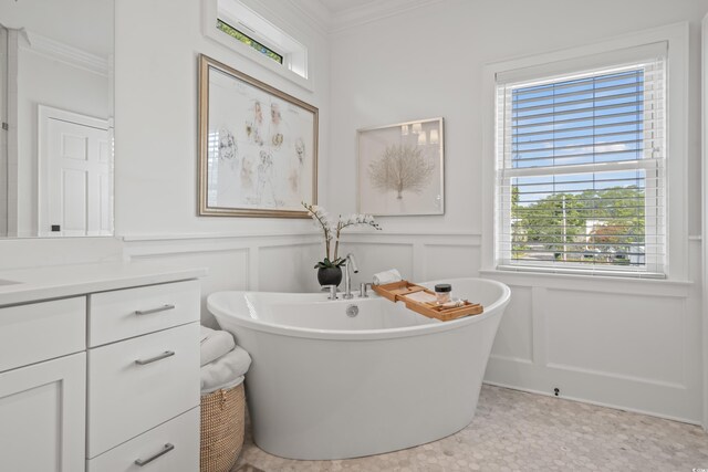 bedroom with a nursery area, hardwood / wood-style flooring, and crown molding