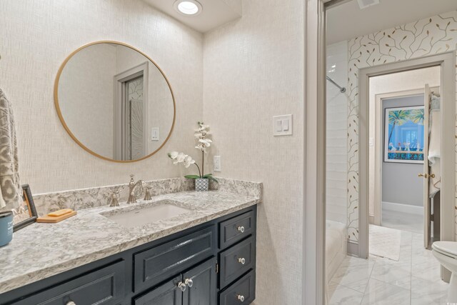 bathroom featuring toilet, tile walls, sink, and ornamental molding