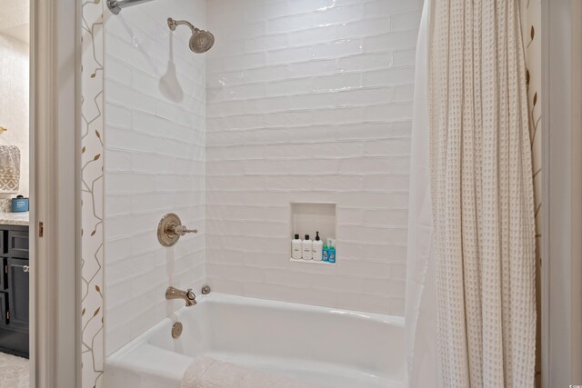 laundry room with cabinets, sink, dark tile patterned floors, ornamental molding, and washing machine and dryer