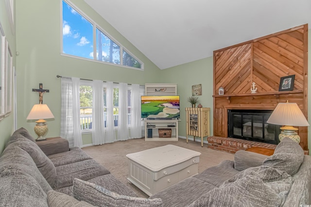 carpeted living room with high vaulted ceiling and a brick fireplace