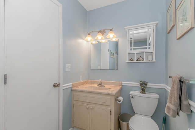 bathroom with vanity and toilet