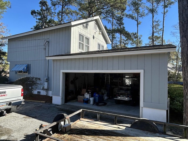 view of side of property featuring a garage