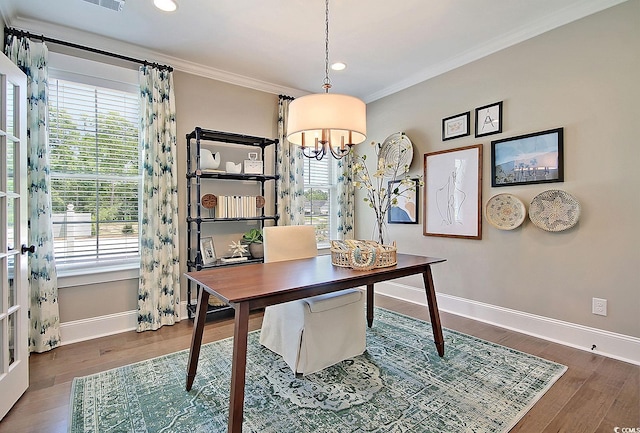 office space with dark hardwood / wood-style flooring, a chandelier, and crown molding