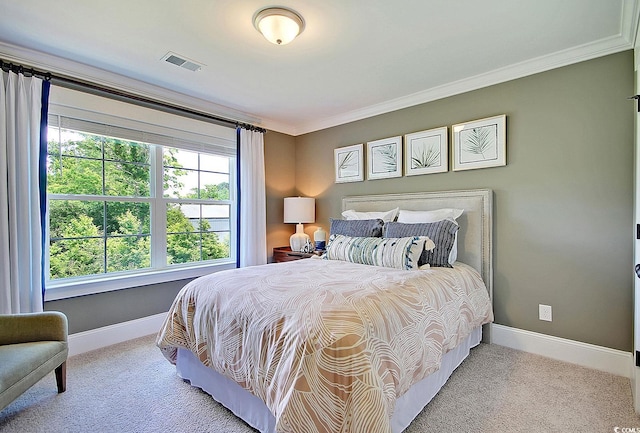 carpeted bedroom with ornamental molding