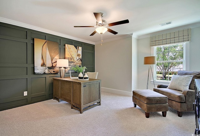 carpeted home office with ceiling fan and crown molding