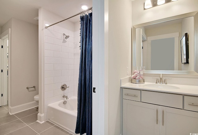 full bathroom featuring shower / bath combo with shower curtain, tile patterned flooring, vanity, and toilet