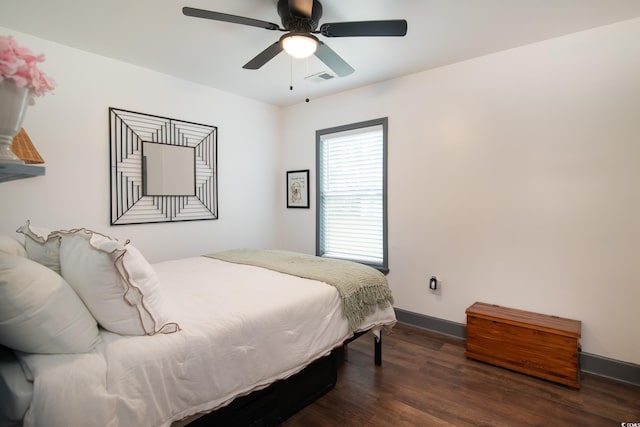 bedroom featuring ceiling fan and dark wood-type flooring