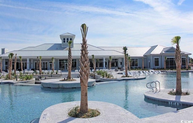 view of swimming pool featuring a patio area