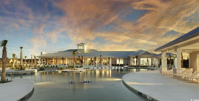 pool at dusk with a water view