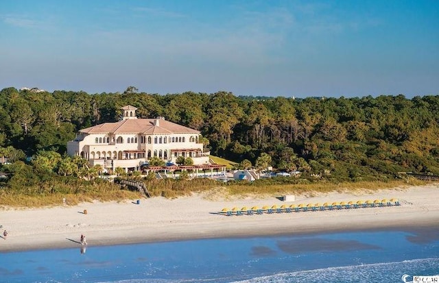 drone / aerial view with a view of the beach and a water view