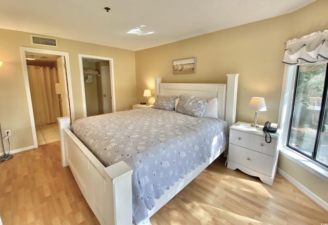 bedroom featuring light wood-type flooring