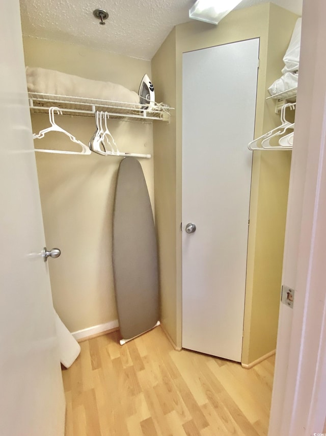 spacious closet featuring hardwood / wood-style floors