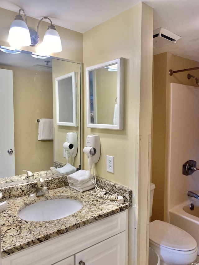 full bathroom featuring vanity, toilet, and shower / bath combination