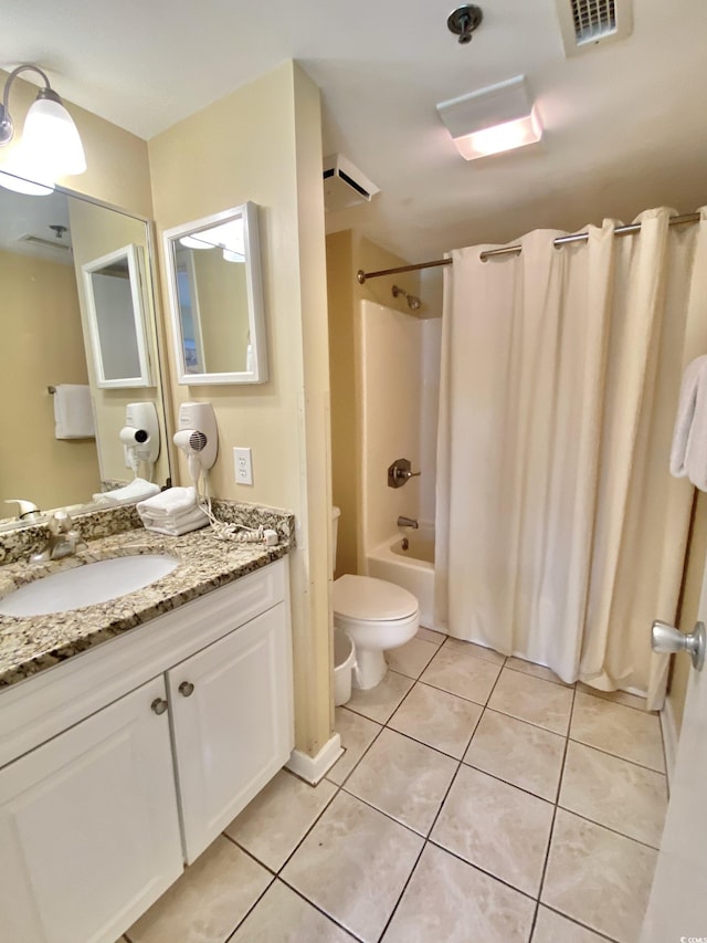 full bathroom featuring tile patterned floors, toilet, vanity, and shower / bath combo