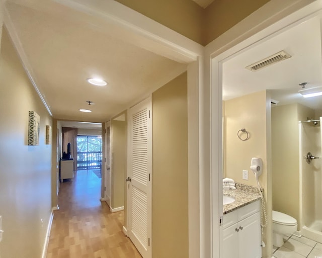 hallway with light wood-type flooring