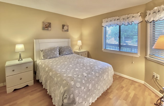 bedroom with light hardwood / wood-style floors