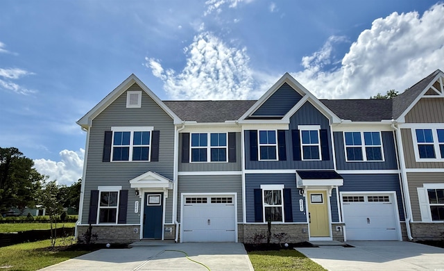 2061 NW Parow Ln NW Unit F, Calabash, NC 28467 - view of front facade with board and batten siding, a front yard, a garage, a residential view, and driveway