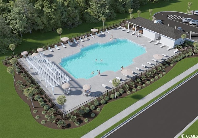 community pool with a patio and fence