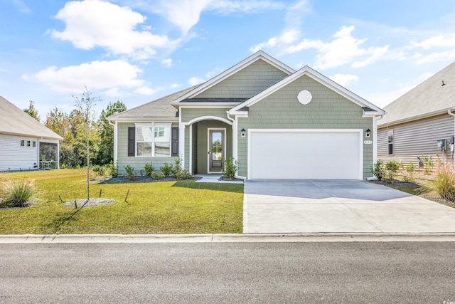 view of front of house with a front lawn and a garage