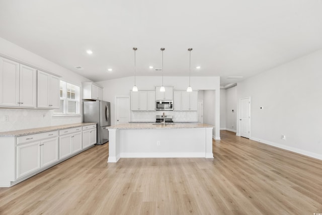 kitchen with white cabinetry, appliances with stainless steel finishes, and light wood-type flooring