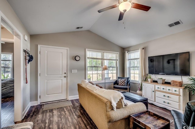 living room featuring vaulted ceiling, ceiling fan, and dark wood-type flooring