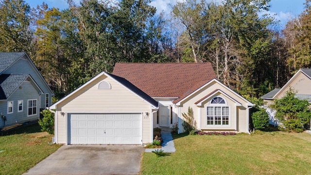 ranch-style house with a garage and a front yard