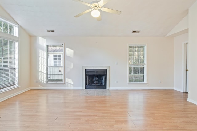 unfurnished living room with vaulted ceiling, ceiling fan, and light hardwood / wood-style flooring