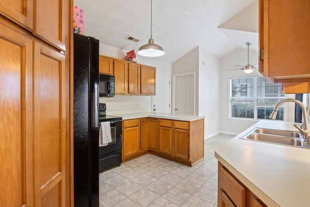 kitchen with black appliances, decorative light fixtures, sink, vaulted ceiling, and ceiling fan