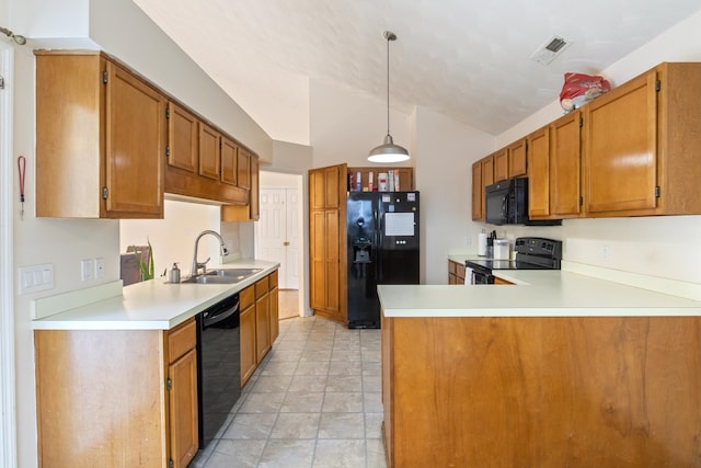 kitchen with lofted ceiling, kitchen peninsula, hanging light fixtures, black appliances, and sink