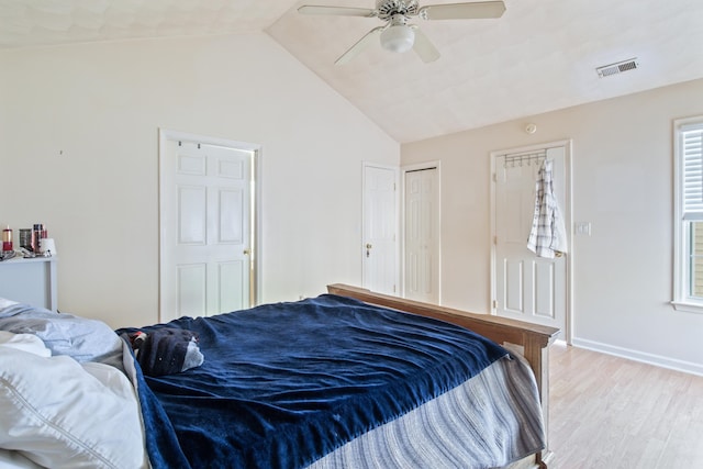 bedroom with vaulted ceiling, ceiling fan, and light hardwood / wood-style flooring