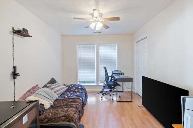 office space with ceiling fan and light hardwood / wood-style flooring