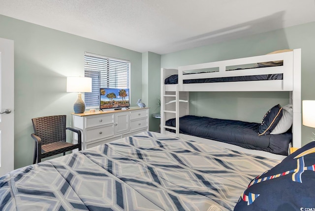 bedroom featuring a textured ceiling