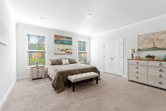 carpeted bedroom with ornamental molding