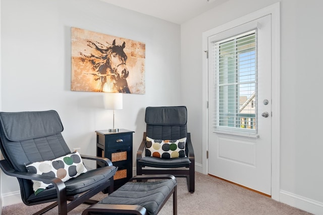 living area featuring carpet flooring and plenty of natural light