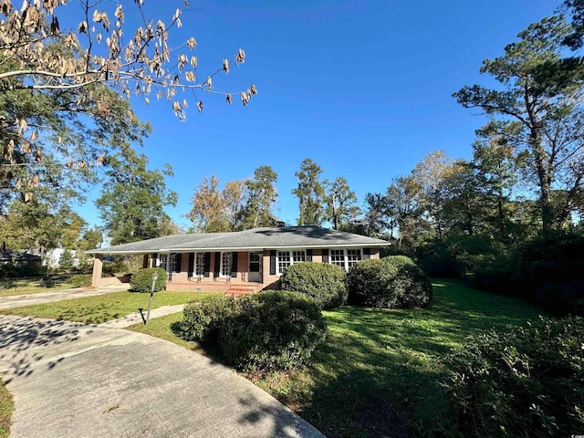 ranch-style house with a front lawn