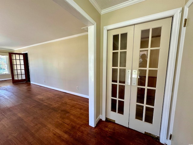 unfurnished room featuring french doors, dark hardwood / wood-style flooring, and crown molding