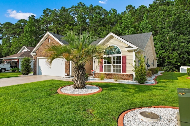 view of front of home with a front lawn and a garage